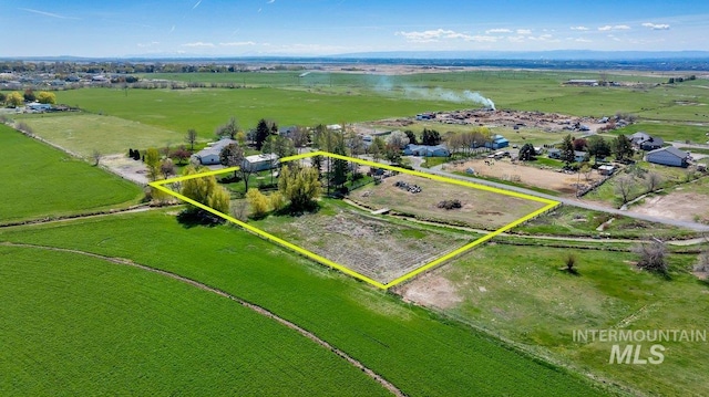 birds eye view of property with a rural view