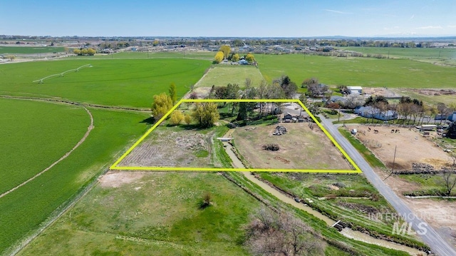 birds eye view of property featuring a rural view