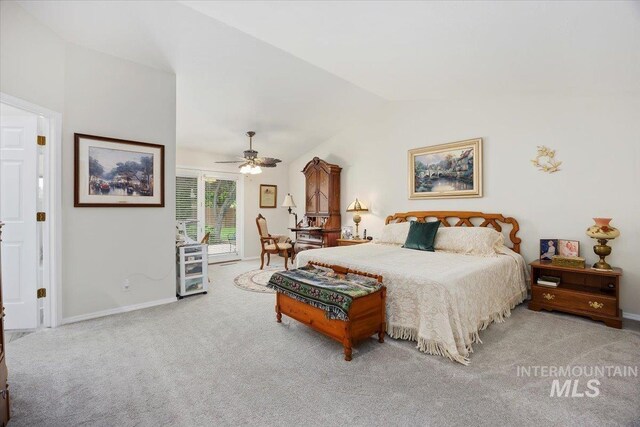 bedroom with carpet, vaulted ceiling, and baseboards