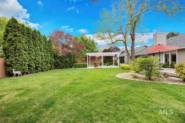 view of yard featuring a pergola and a patio