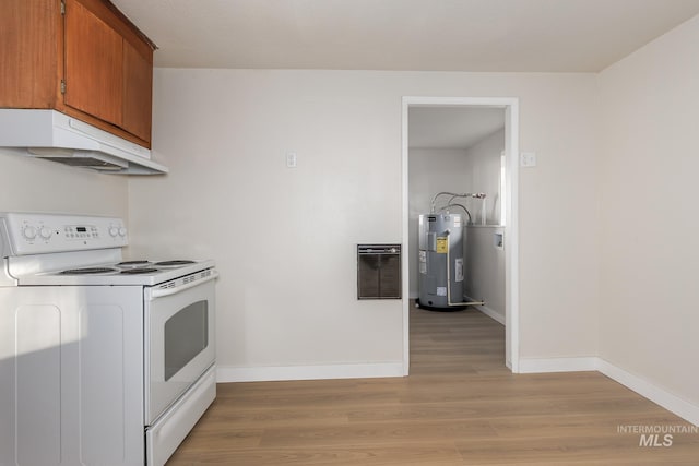 kitchen with heating unit, brown cabinetry, water heater, under cabinet range hood, and white electric range