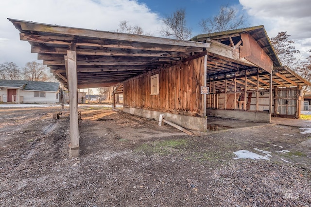 view of outbuilding with a carport