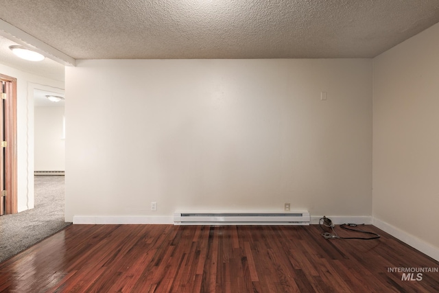 unfurnished room featuring a baseboard heating unit, baseboards, wood finished floors, a textured ceiling, and a baseboard radiator