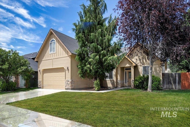 craftsman-style house featuring a garage and a front lawn