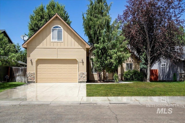 view of front of home with a front lawn and a garage