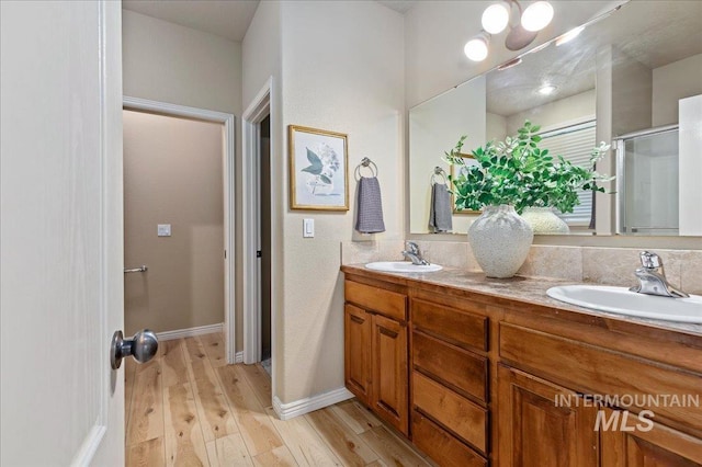 bathroom featuring hardwood / wood-style floors and vanity