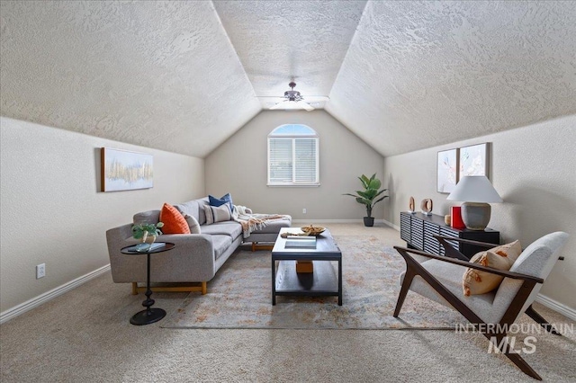 living room featuring carpet flooring, a textured ceiling, ceiling fan, and lofted ceiling