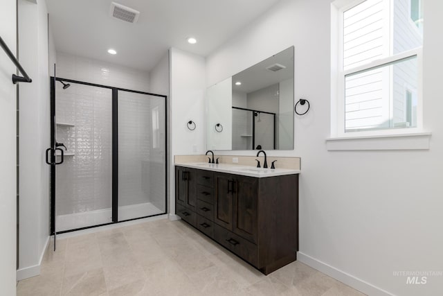 6170 W Pewter Point St, Meridian, ID 83646 - full bath featuring double vanity, a shower stall, baseboards, and recessed lighting