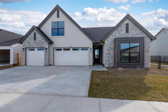 view of front of home featuring a garage and a front lawn