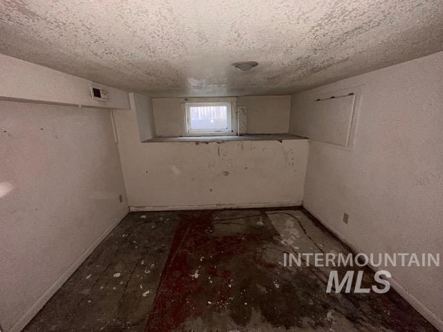 basement with a textured ceiling