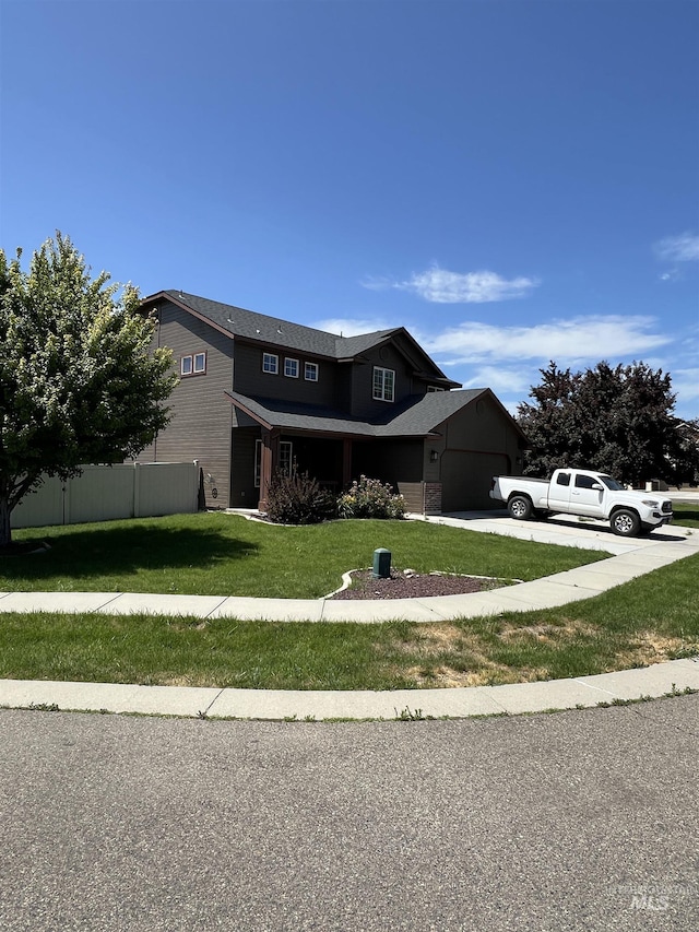 2059 Spring Creek Dr, Fruitland, ID 83619 - view of front of home featuring driveway and an attached garage