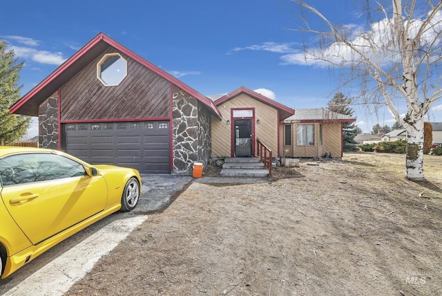 view of front of property featuring driveway and a garage