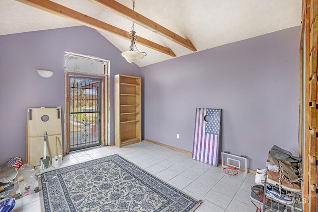 interior space with tile patterned floors, vaulted ceiling with beams, and baseboards