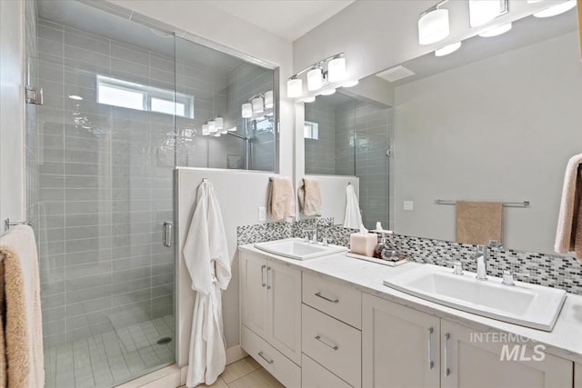 1765 E Bergeson St, Boise, ID 83706 - full bathroom with a stall shower, double vanity, tasteful backsplash, and tile patterned flooring