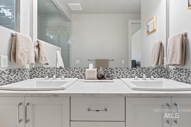 1765 E Bergeson St, Boise, ID 83706 - bathroom featuring tasteful backsplash, double vanity, and a shower stall