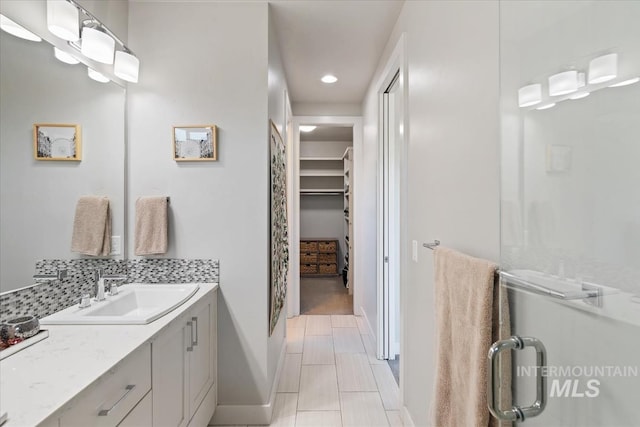 1765 E Bergeson St, Boise, ID 83706 - full bathroom with a walk in closet, baseboards, a shower stall, vanity, and recessed lighting