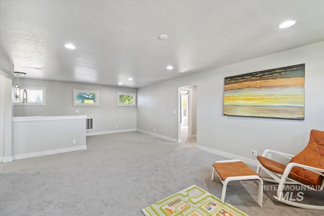 1765 E Bergeson St, Boise, ID 83706 - recreation room featuring recessed lighting, baseboards, light colored carpet, and a textured ceiling