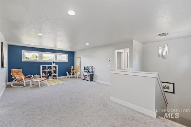 1765 E Bergeson St, Boise, ID 83706 - living area featuring carpet, baseboards, recessed lighting, a textured ceiling, and an upstairs landing