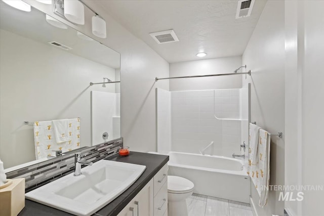1765 E Bergeson St, Boise, ID 83706 - full bathroom with toilet, vanity, shower / bathtub combination, decorative backsplash, and marble finish flooring