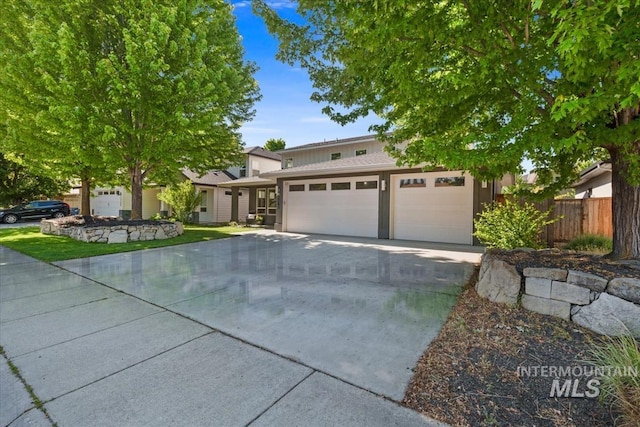 1765 E Bergeson St, Boise, ID 83706 - view of front of house with concrete driveway and a garage