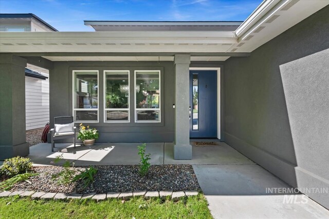 1765 E Bergeson St, Boise, ID 83706 - view of exterior entry featuring covered porch and stucco siding