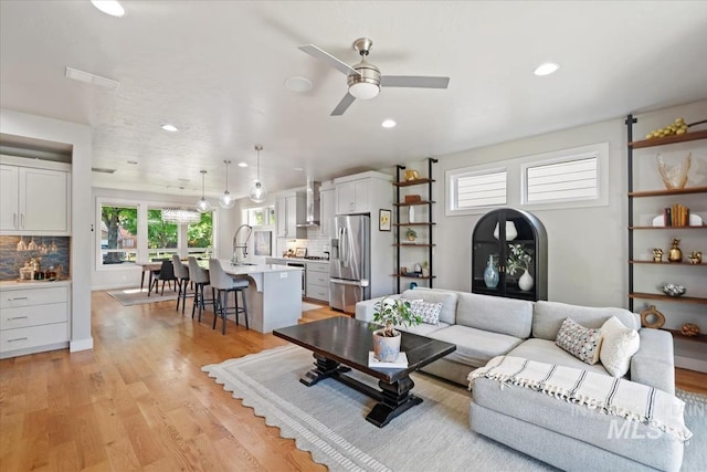 1765 E Bergeson St, Boise, ID 83706 - living room with a ceiling fan, light wood finished floors, and recessed lighting