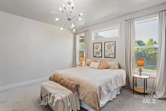 1765 E Bergeson St, Boise, ID 83706 - carpeted bedroom with a chandelier and baseboards