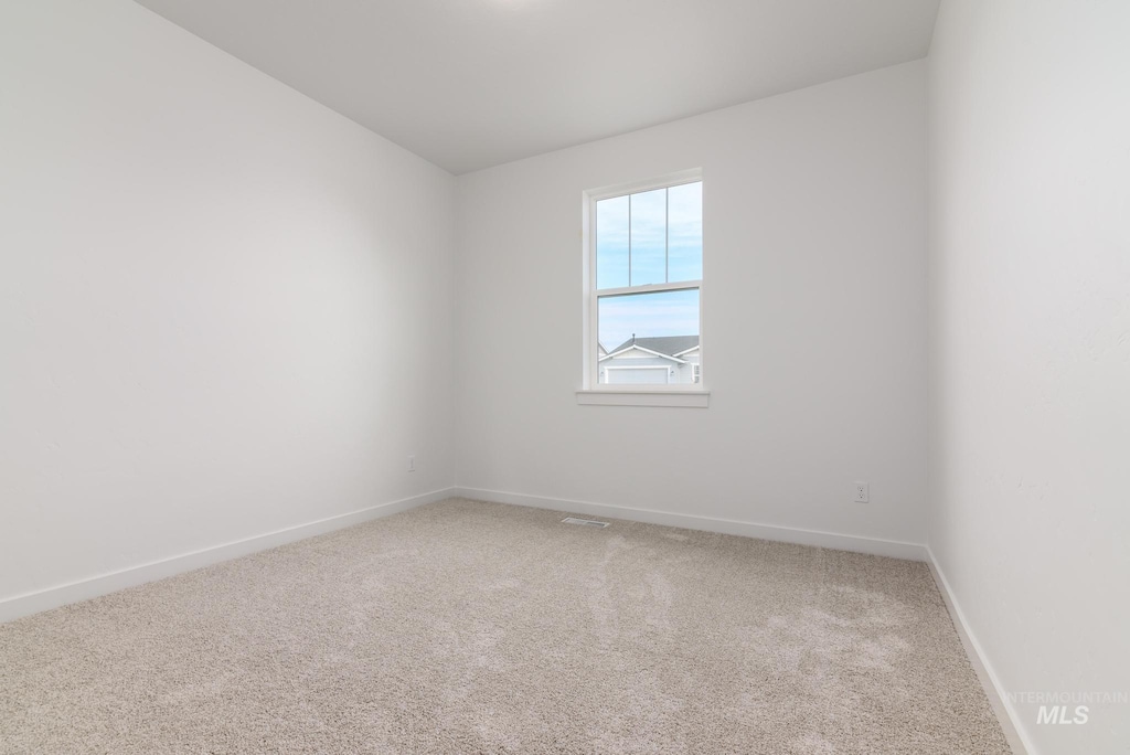 spare room with carpet floors