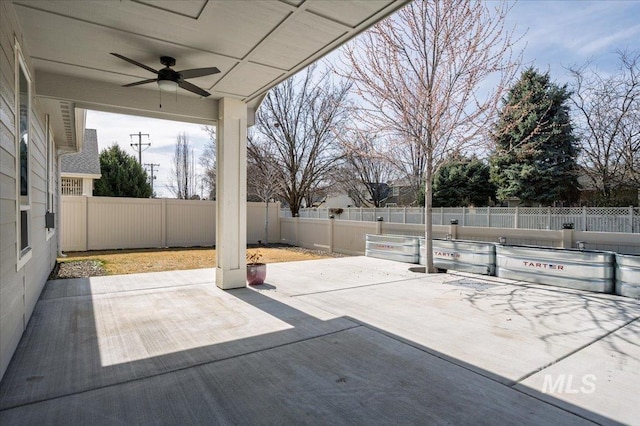 view of patio featuring ceiling fan and a fenced backyard