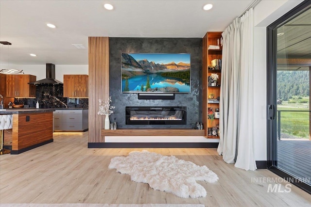 15 Alder Creek Ln, Garden Valley, ID 83622 - living area with light wood-style flooring, a large fireplace, and recessed lighting