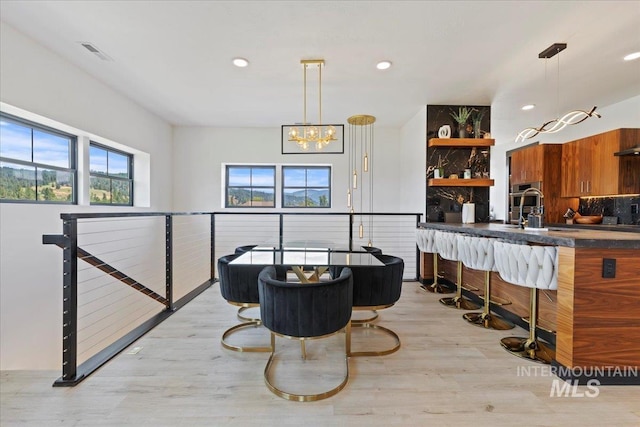 15 Alder Creek Ln, Garden Valley, ID 83622 - dining area with light wood finished floors, a chandelier, and recessed lighting