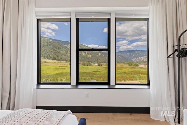 15 Alder Creek Ln, Garden Valley, ID 83622 - bedroom featuring a mountain view and wood finished floors