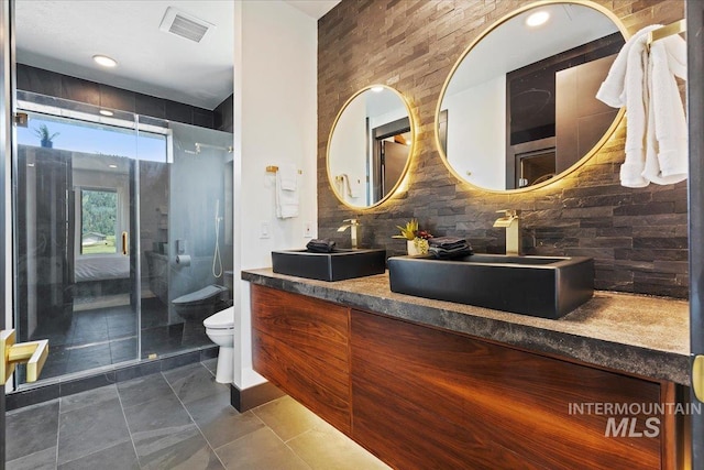 15 Alder Creek Ln, Garden Valley, ID 83622 - full bath with double vanity, a shower stall, and backsplash