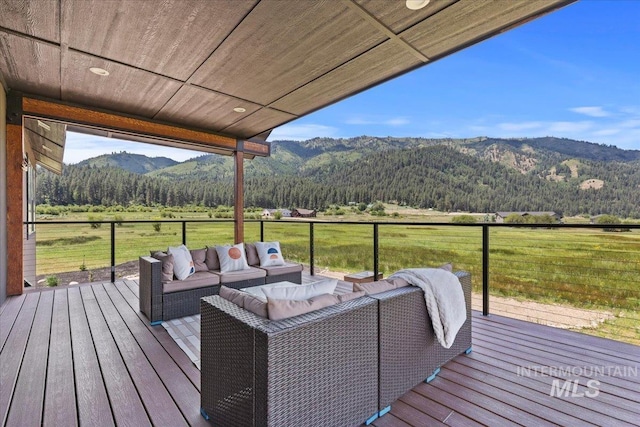 15 Alder Creek Ln, Garden Valley, ID 83622 - wooden deck featuring a mountain view, an outdoor living space, a view of rural / pastoral area, and a forest view
