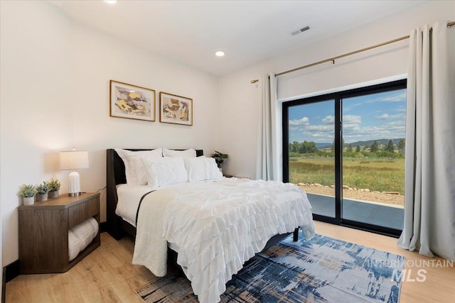 15 Alder Creek Ln, Garden Valley, ID 83622 - bedroom with access to outside, light wood-style flooring, and recessed lighting