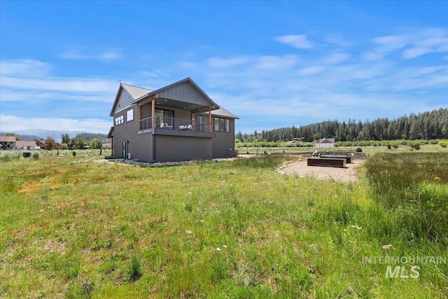 15 Alder Creek Ln, Garden Valley, ID 83622 - rear view of property featuring a balcony