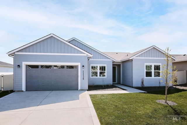 view of front of home with a garage, a front lawn, board and batten siding, and concrete driveway