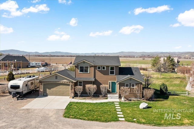 1375 Ross Rd, Weiser, ID 83672 - traditional-style home with a mountain view, a garage, and concrete driveway
