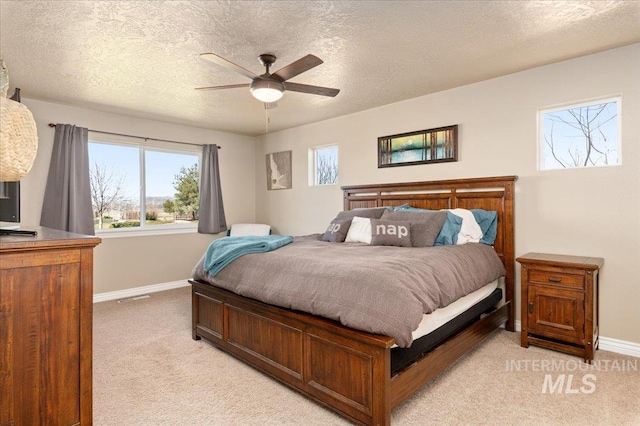 1375 Ross Rd, Weiser, ID 83672 - bedroom featuring light carpet, a textured ceiling, and ceiling fan