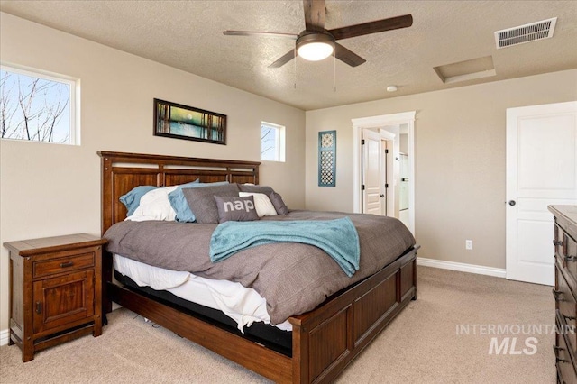 1375 Ross Rd, Weiser, ID 83672 - bedroom with light colored carpet, attic access, a textured ceiling, and a ceiling fan