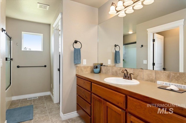 1375 Ross Rd, Weiser, ID 83672 - full bathroom with vanity, a chandelier, tile patterned flooring, and combined bath / shower with glass door