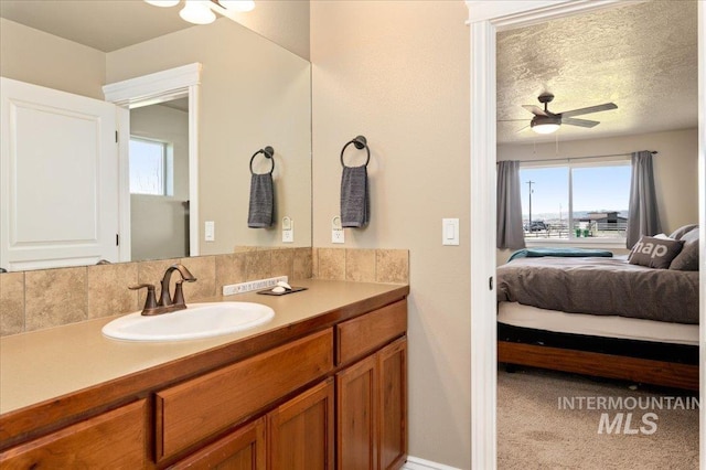 1375 Ross Rd, Weiser, ID 83672 - bathroom featuring vanity, connected bathroom, plenty of natural light, and ceiling fan