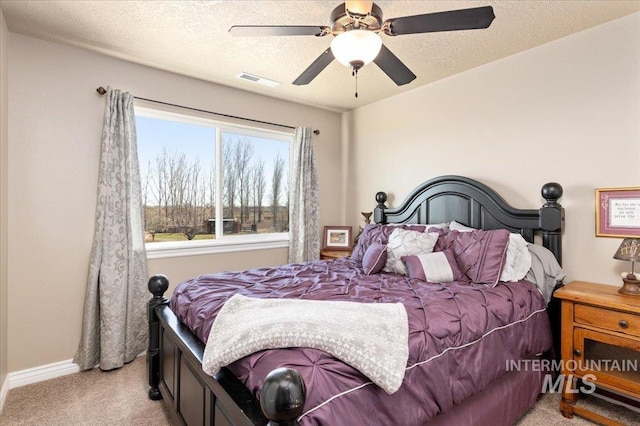 1375 Ross Rd, Weiser, ID 83672 - bedroom with light colored carpet, a textured ceiling, and a ceiling fan
