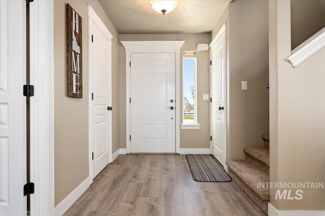 1375 Ross Rd, Weiser, ID 83672 - entrance foyer with light wood-style floors and stairway