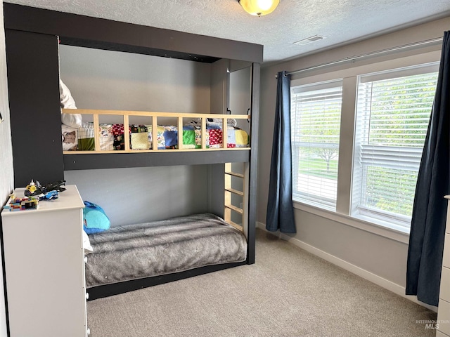 4446 S Carina Way, Meridian, ID 83642 - bedroom with carpet flooring, baseboards, and a textured ceiling