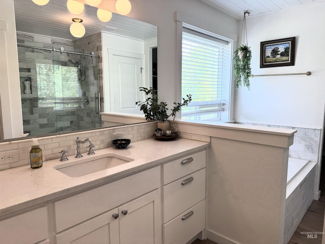 4446 S Carina Way, Meridian, ID 83642 - full bath with a stall shower, vanity, backsplash, and tiled bath