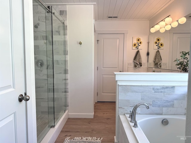 4446 S Carina Way, Meridian, ID 83642 - full bath featuring a stall shower, wood ceiling, a garden tub, wood finished floors, and baseboards