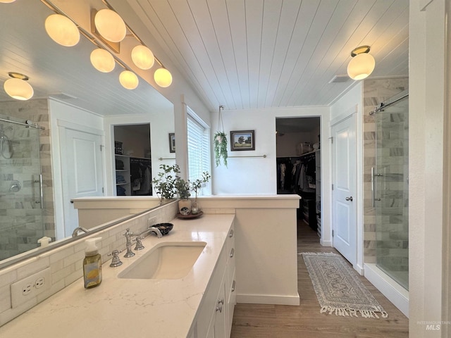 4446 S Carina Way, Meridian, ID 83642 - bathroom with a shower stall, vanity, wood finished floors, wood ceiling, and a spacious closet