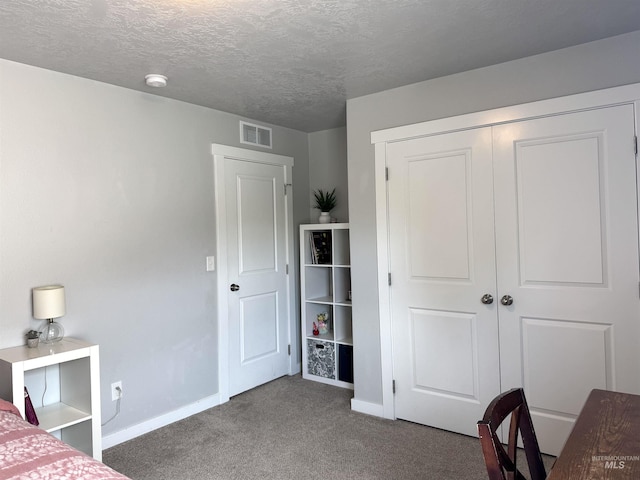 4446 S Carina Way, Meridian, ID 83642 - bedroom with carpet floors, baseboards, a closet, and a textured ceiling