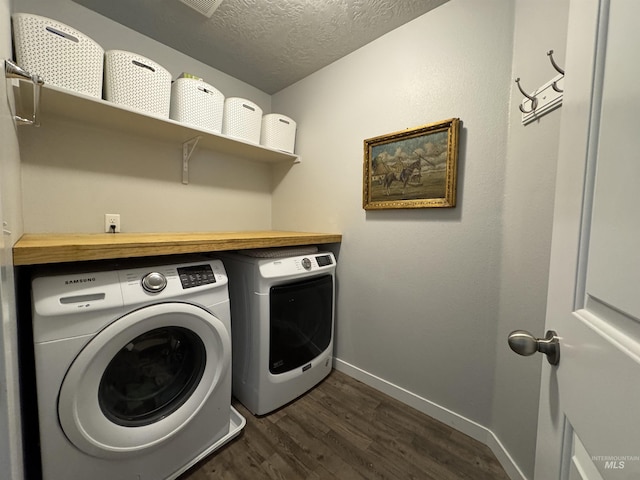4446 S Carina Way, Meridian, ID 83642 - clothes washing area featuring washer and clothes dryer, dark wood-style flooring, baseboards, and a textured ceiling